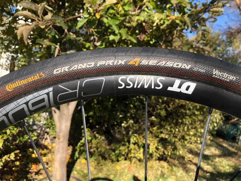 Continental Grand Prix 4 Season bike tire sidewall mounted on rim