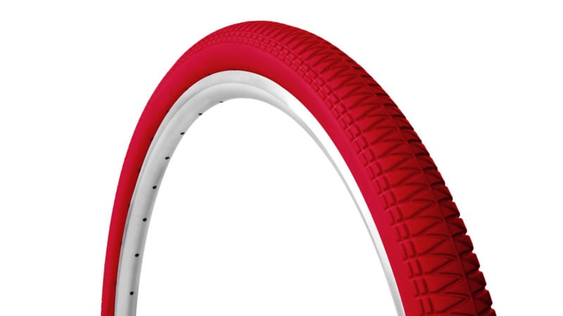 45-degree angle red Tannus Razor Blade foam airless tire attached to rim showing moderate tread pattern