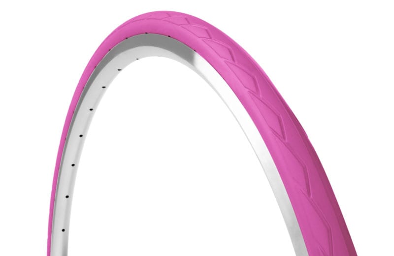 45-degree angle pink Tannus Semi Slick foam airless tire attached to rim