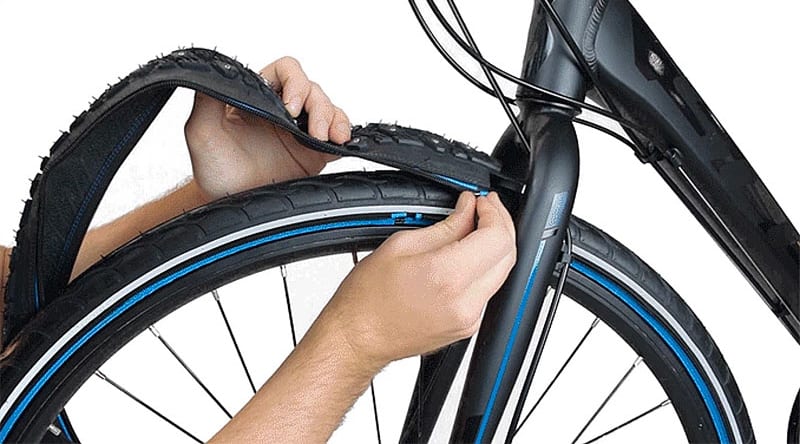 reTyre one base tire with skin beginning to zip on top